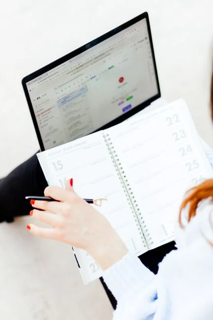 Contemporary office desk setup with computer displaying a business chart.